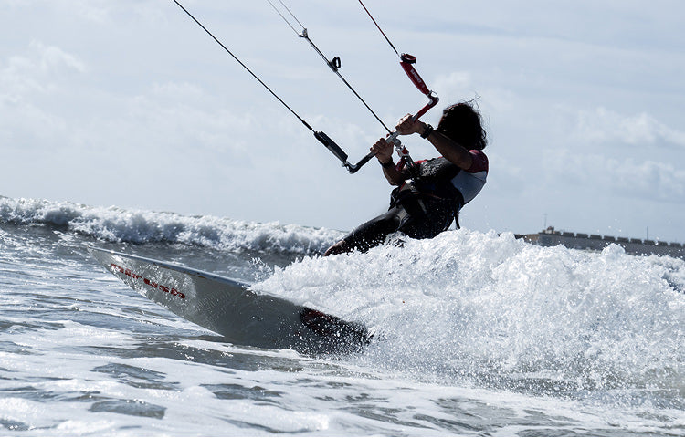 A man kitesurfing