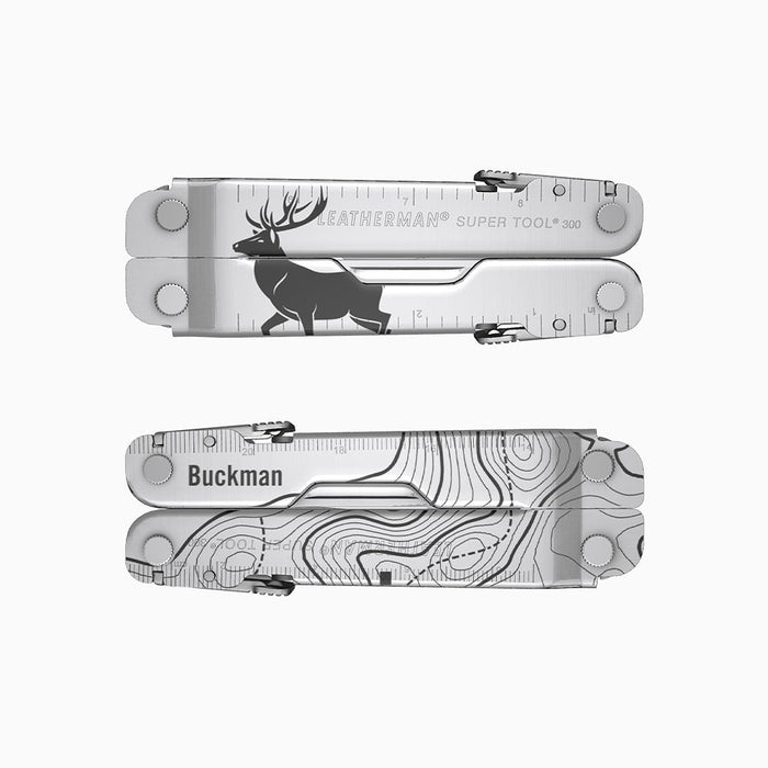 A stainless steel Leatherman Super Tool 300 engraved with a topographic map and a large elk silhouette. A placeholder name “Buckman” appears above the topographic design.